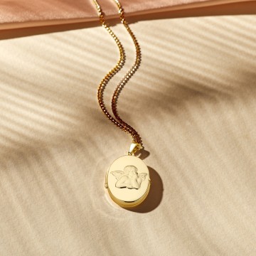 1 gouden medaillon ovaaltje met beschermengel