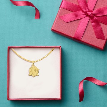 1 gouden meisjes kinderkopje met achterkant gravure klein