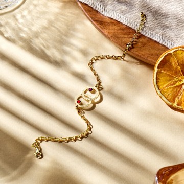 1 gouden moederdochterarmband met twee rondjes en geboortestenen